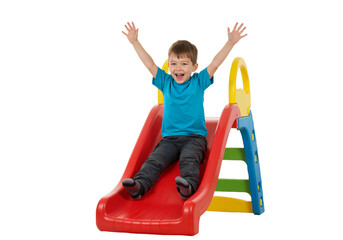 little boy playing on a slide