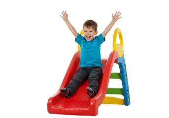 little boy playing on a slide