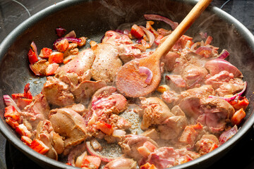 Cooking chicken liver on frying pan