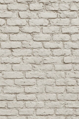 Obraz premium Seamless white brick wall texture with rough surface and natural shadows, perfect for backgrounds, interior, or design mockups.
