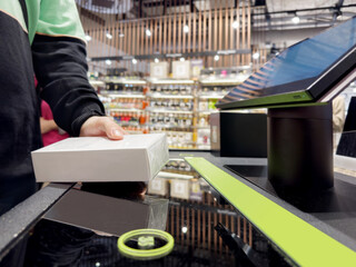 buying make up at cosmetics section in store,self checkout systems in  retail stores,Barcode scanner,Self checkout machine