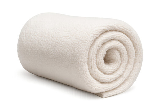 Plush white fleece blanket rolled softly, providing cozy winter comfort against clean background