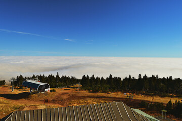 Clouds Engulf Valley While Hilltop Architecture Catches the Light