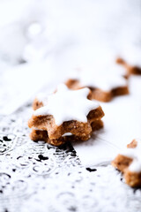 Christmas cookies (cinnamon stars) on bright background. Close up.	