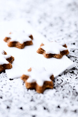 Christmas cookies (cinnamon stars) on bright background. Close up.	