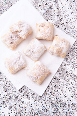 Stollen Bites on bright background. Soft focus. Close up. Copy space.	