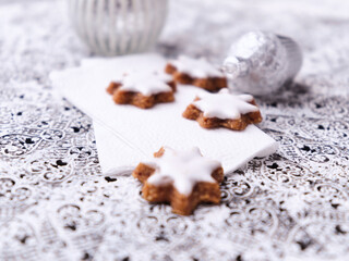 Christmas cookies (cinnamon stars) on bright background. Close up.	