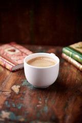 Cup of coffee on wooden background. Soft focus. Copy space