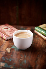 Cup of coffee on wooden background. Soft focus. Copy space