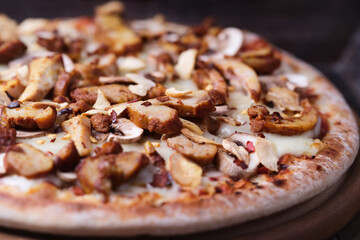 Gyros Pizza with with champignons and mozzarella cheese. Wooden background. Soft focus.