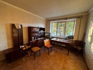 Old Soviet-Style Living Room with Vintage Furniture and Natural Light