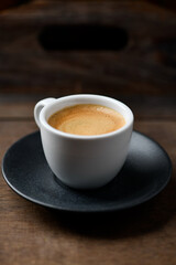 Cup of coffee on wooden background. Soft focus. Copy space	