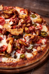 Gyros Pizza with jalapeno pepper, cherry tomatoes and mozzarella cheese. Soft focus. Close up.