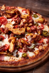 Gyros Pizza with jalapeno pepper, cherry tomatoes and mozzarella cheese. Soft focus. Close up.