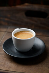 Cup of coffee on wooden background. Soft focus. Copy space	