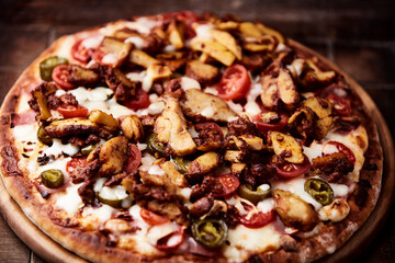 Gyros Pizza with jalapeno pepper, cherry tomatoes and mozzarella cheese. Soft focus. Close up.	