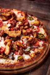 Gyros Pizza with jalapeno pepper, cherry tomatoes and mozzarella cheese. Soft focus. Close up.	