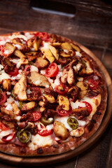 Gyros Pizza with jalapeno pepper, cherry tomatoes and mozzarella cheese. Soft focus. Close up.	