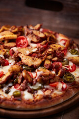 Gyros Pizza with jalapeno pepper, cherry tomatoes and mozzarella cheese. Soft focus. Close up.	