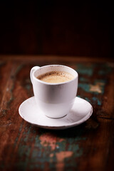 Cup of coffee on wooden background. Soft focus. Copy space	