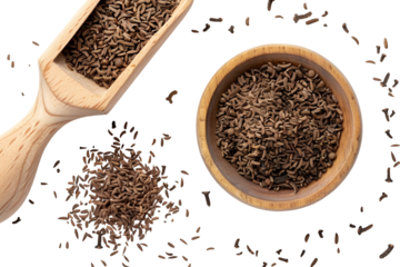 Caraway seeds in wooden bowl and scoop dark background