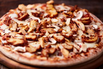 Gyros Pizza with with champignons and mozzarella cheese. Wooden background. Soft focus.	