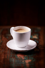 Cup of coffee on wooden background. Soft focus. Copy space	