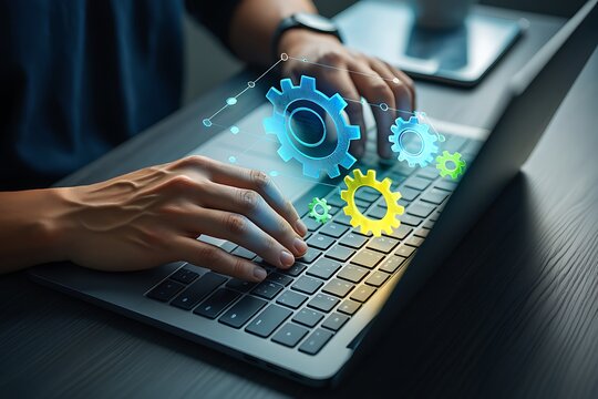 Person typing on laptop with gears graphic overlay