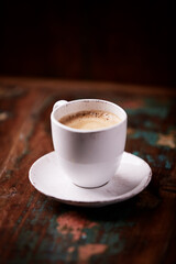 Cup of coffee on wooden background. Soft focus. Copy space	
