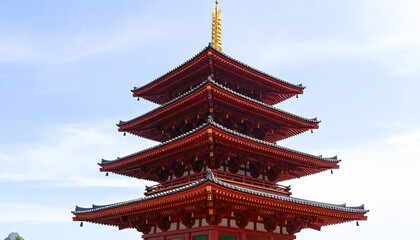 Naklejka premium Red pagoda against a clear sky