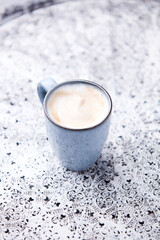 Cappuccino on bright background. Soft focus. Copy space	