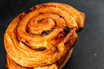 Raisin bun sweet pastry dessert puff pastry fresh delicious gourmet food background on the table...