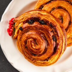 Raisin bun sweet pastry dessert puff pastry fresh delicious gourmet food background on the table...
