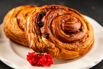 Raisin bun sweet pastry dessert puff pastry fresh delicious gourmet food background on the table...