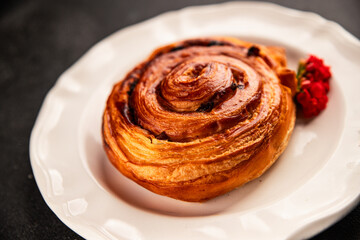 Raisin bun sweet pastry dessert puff pastry fresh delicious gourmet food background on the table rustic food top view copy space