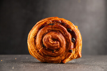 Raisin bun sweet pastry dessert puff pastry fresh delicious gourmet food background on the table...