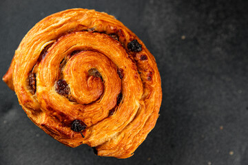Raisin bun sweet pastry dessert puff pastry fresh delicious gourmet food background on the table...