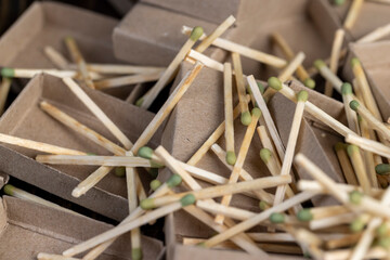 Chaotically scattered wooden matches without matchboxes on the table, a large number of wooden...
