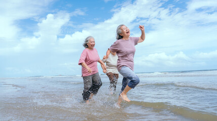 Three women enjoy a joyful walk along the beach during a sunny afternoon with gentle waves and...