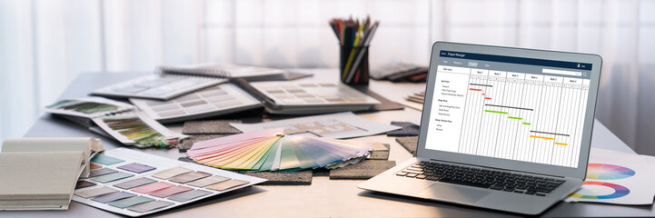 Project planning software for brisk business project management on the computer screen showing...