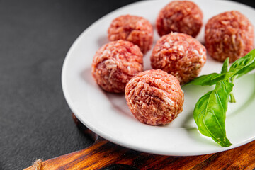 Meatballs raw meat pork, beef, chicken fresh delicious gourmet food background on the table rustic food top view copy space