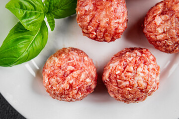 Meatballs raw meat pork, beef, chicken fresh delicious gourmet food background on the table rustic...