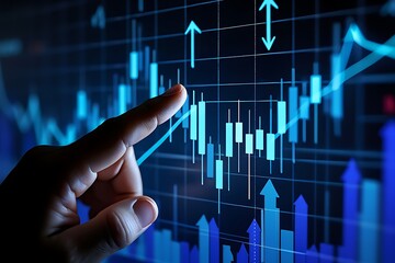 Finger pointing at a stock market chart on screen