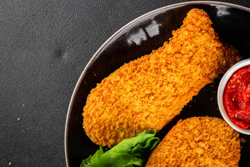 Fish sticks fishs shaped breaded fish nuggets fast food fresh delicious gourmet food background on the table rustic food top view copy space