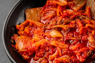 Kimchi pickled cabbage salad spicy savory vegetables fresh delicious gourmet food background on the table rustic food top view copy space vegetarian and vegan food