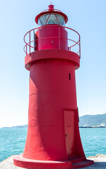 Red lighthouse in La Spezia harbour, Liguria, Italy