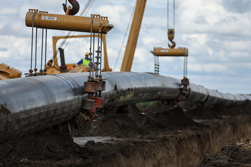 Installation of a huge industrial gas pipe line on a field