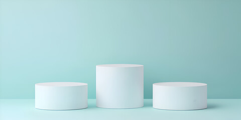 Three white cylindrical pedestals on a light blue background