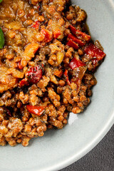 Lentil dish vegetables and roasted peppers savory vegetable fresh vegetarian and vegan food gourmet food background on the table rustic food top view copy space keto and paleo diet