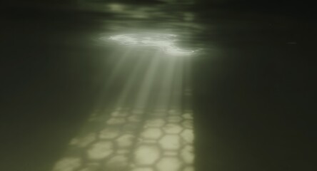 Underwater scene with sunlight beams piercing through the surface illuminating a textured pattern below casting a serene atmosphere. The view is looking upward.
